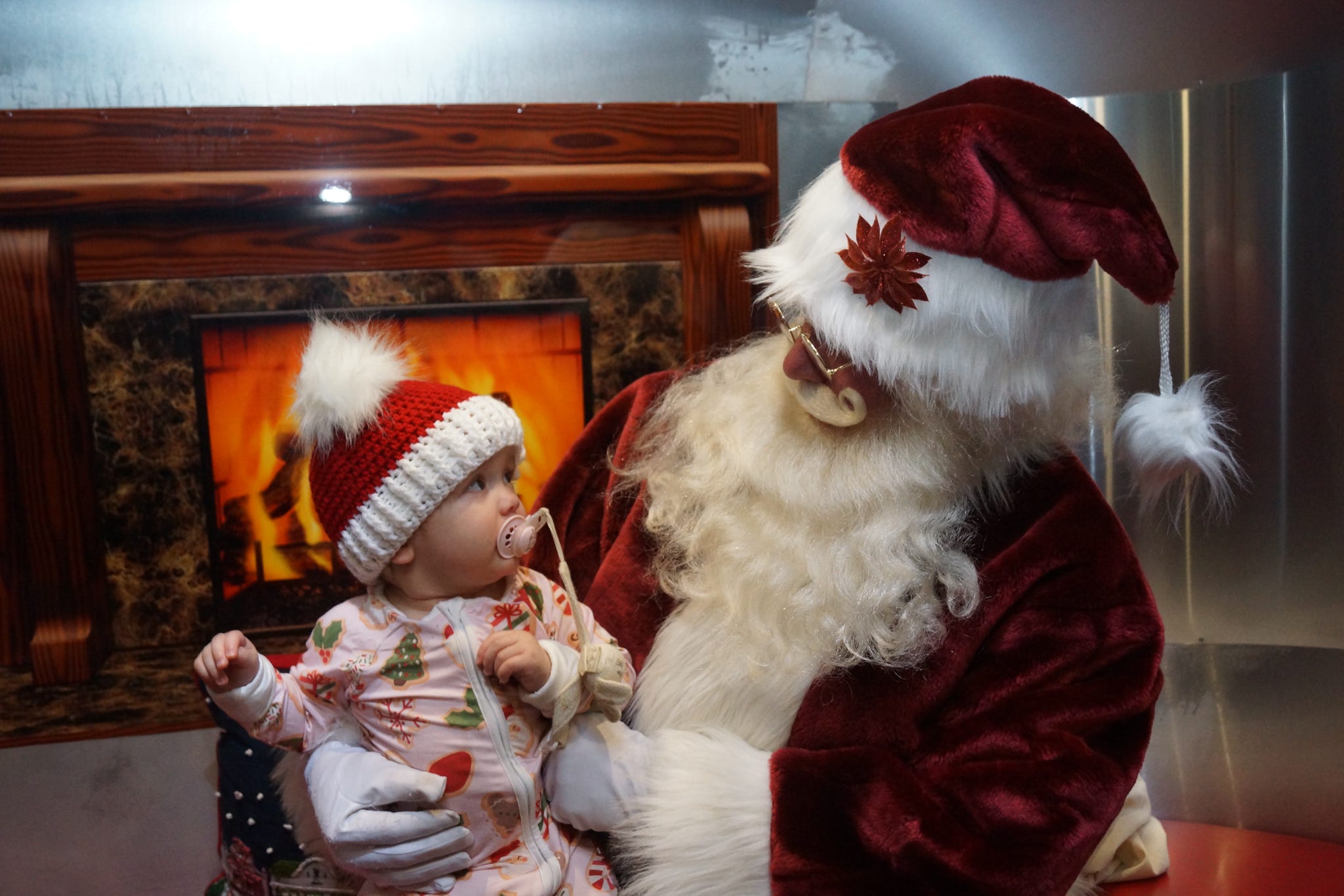 The Long Island Polar Express conductor reading your golden ticket before boarding the Polar Express train ride